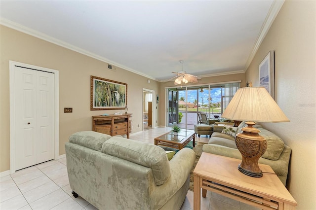 tiled living room featuring ceiling fan and ornamental molding