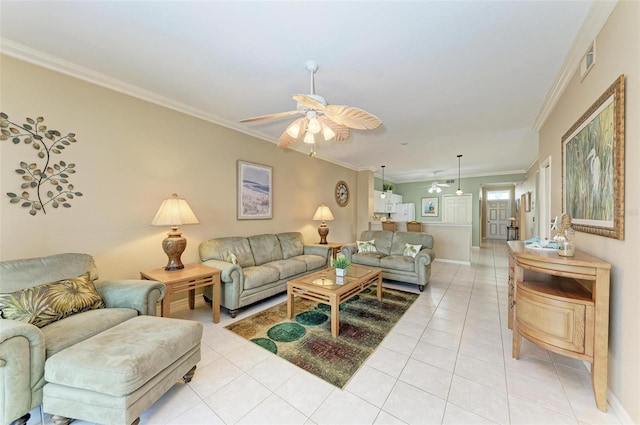 tiled living room with ceiling fan and crown molding