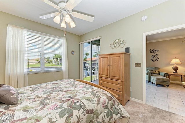 bedroom featuring access to outside, ceiling fan, and light colored carpet