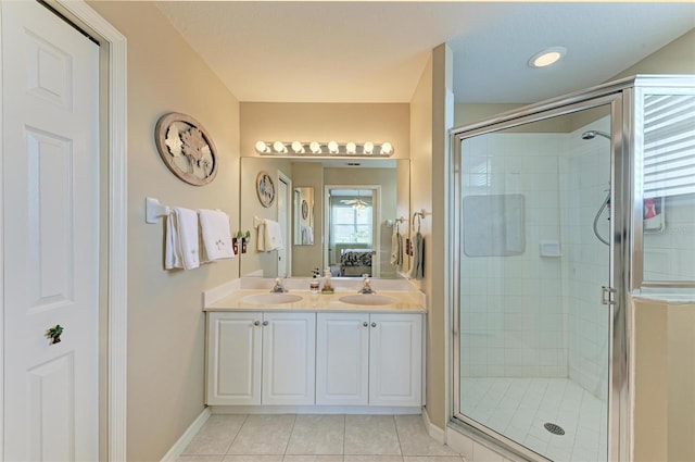 bathroom featuring tile patterned floors, vanity, and an enclosed shower