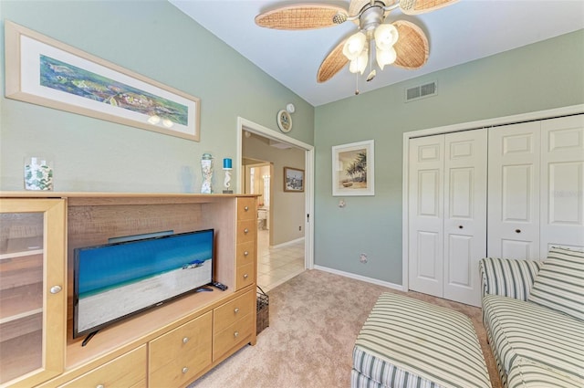 living room with light carpet and ceiling fan