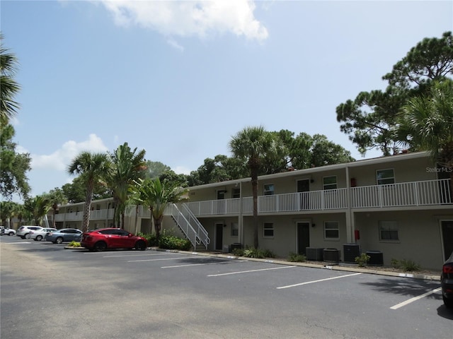 view of building exterior with central AC unit