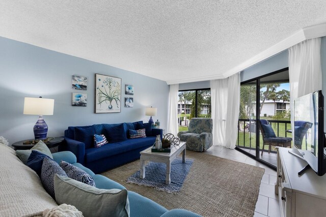 living room with a textured ceiling and tile patterned floors