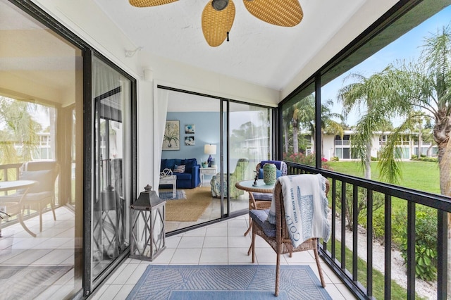 sunroom / solarium with lofted ceiling and a ceiling fan