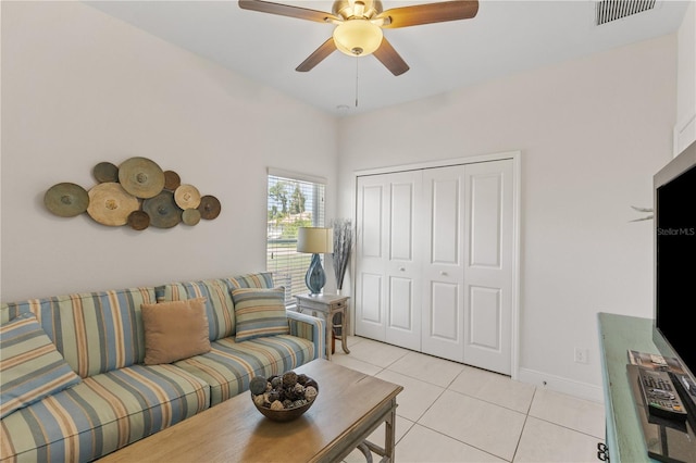 living room with ceiling fan and light tile floors