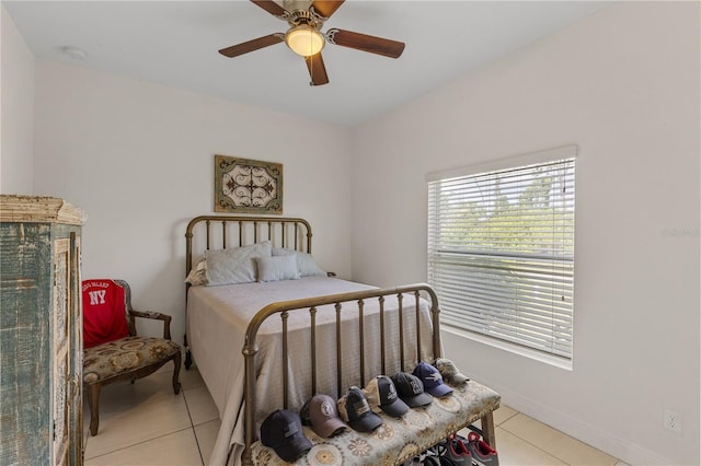 tiled bedroom with ceiling fan