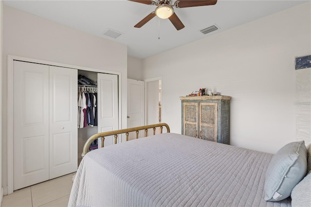 tiled bedroom with a closet and ceiling fan