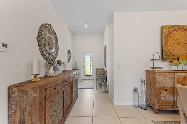 hallway with light tile flooring