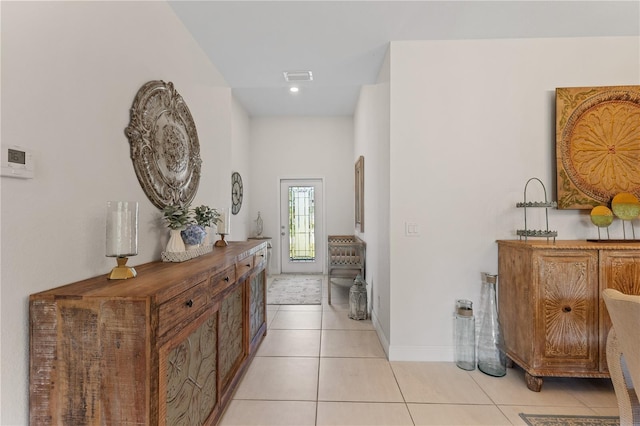 corridor with light tile patterned floors