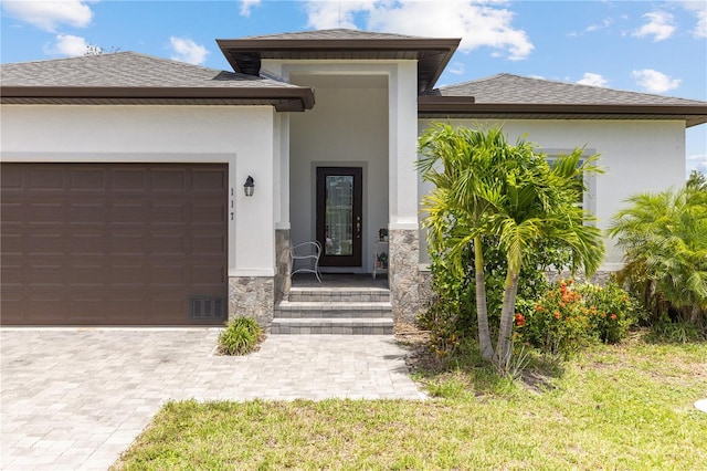 entrance to property featuring a garage