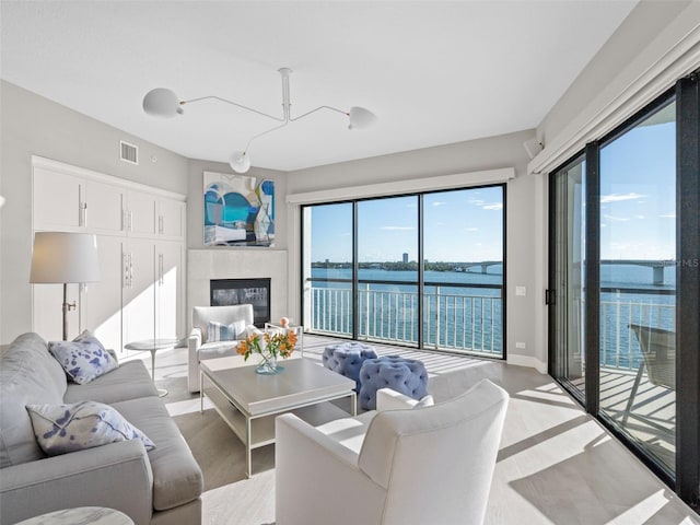 living room with a wealth of natural light and a water view