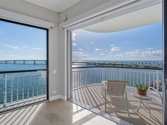 balcony featuring a water view