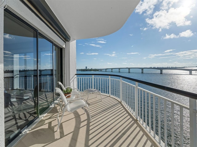 balcony featuring a water view