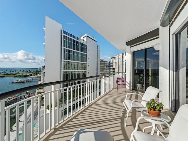 balcony featuring a water view