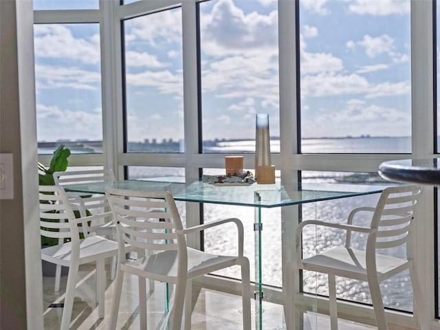 dining room featuring a water view