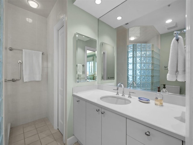 bathroom featuring tile patterned flooring and vanity