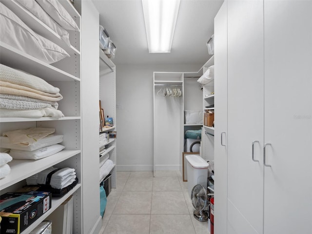 walk in closet featuring light tile patterned floors