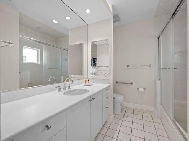 full bathroom with tile patterned flooring, combined bath / shower with glass door, toilet, and vanity