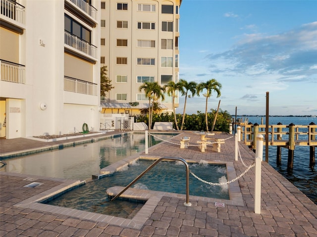 view of swimming pool with a water view