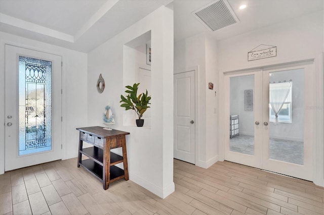 5415 Limelight Dr, Apollo Beach, FL 33572 - foyer featuring french doors, light wood-type flooring, and baseboards