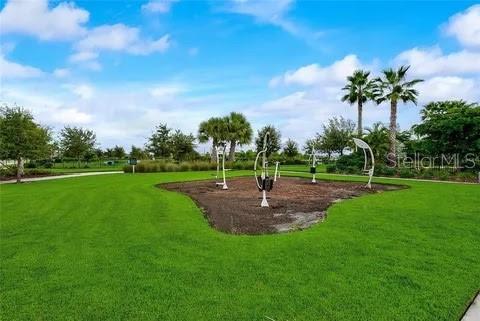 5415 Limelight Dr, Apollo Beach, FL 33572 - view of community with a lawn