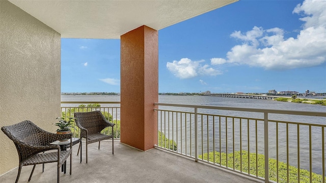 balcony featuring a water view