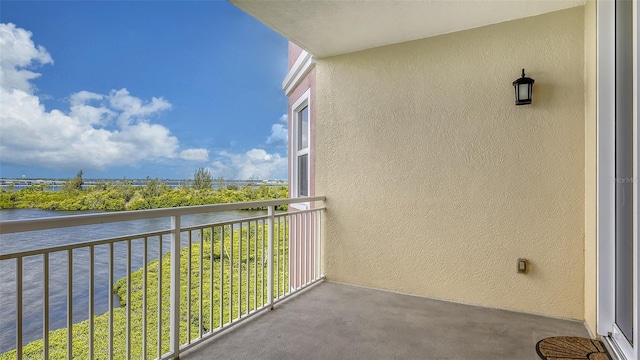 balcony featuring a water view