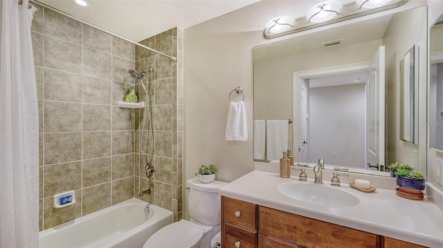 full bathroom featuring vanity, toilet, and shower / tub combo with curtain