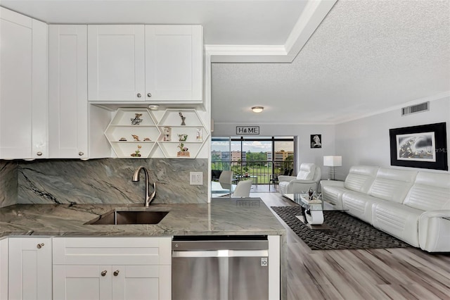 kitchen with white cabinets, dishwasher, backsplash, and sink