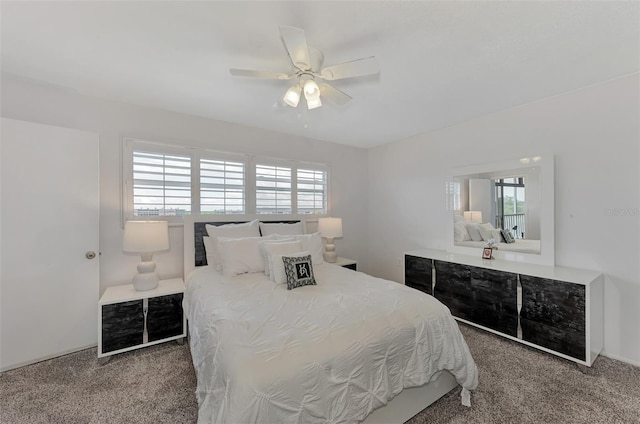 bedroom featuring ceiling fan and carpet