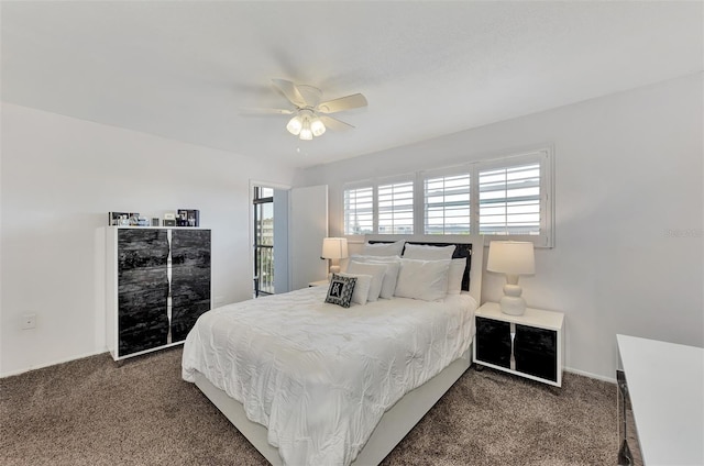 bedroom with ceiling fan and dark colored carpet