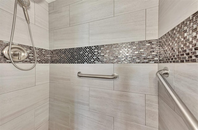 bathroom with a tile shower