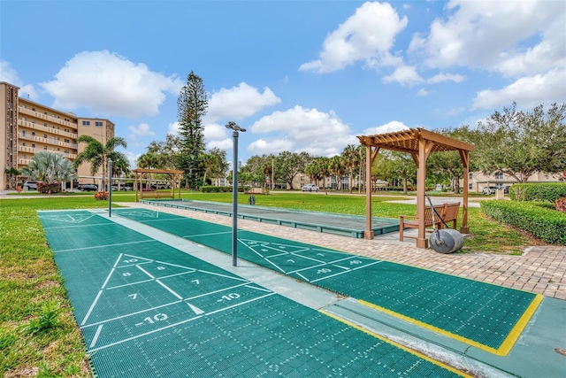 surrounding community featuring a pergola and a yard