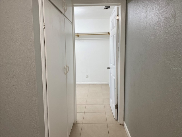 hallway with light tile patterned flooring