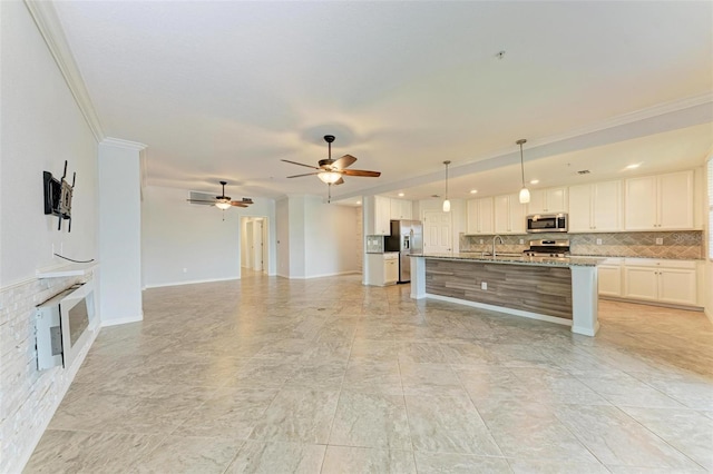 unfurnished living room with ceiling fan, sink, heating unit, and ornamental molding