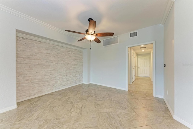 empty room featuring ceiling fan and crown molding