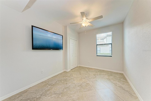 empty room featuring ceiling fan