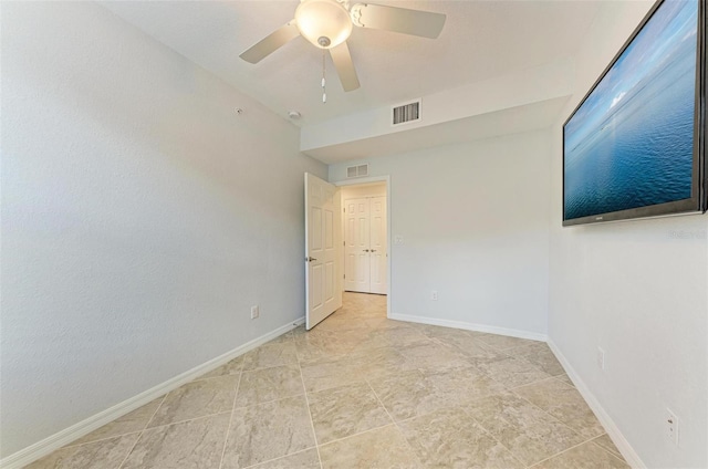 unfurnished room with ceiling fan