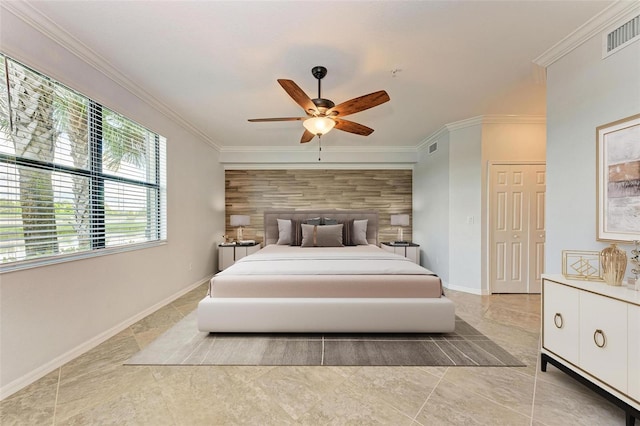 bedroom featuring ceiling fan, ornamental molding, and wooden walls