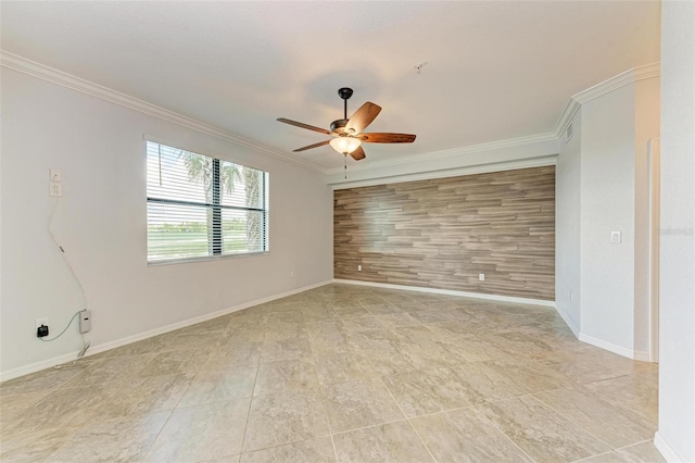 unfurnished room with ceiling fan, ornamental molding, and wood walls