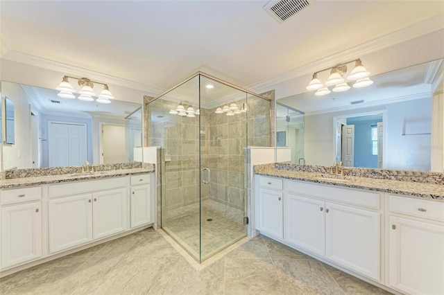 bathroom with vanity, ornamental molding, and a shower with door