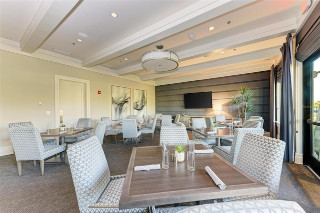 dining room with beam ceiling and crown molding