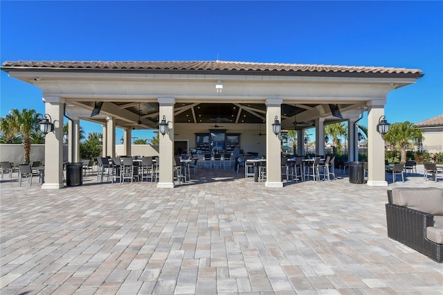 view of patio / terrace featuring ceiling fan and a gazebo