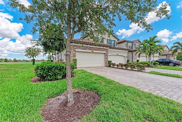 view of front facade with a garage and a front yard