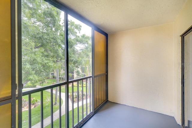 unfurnished sunroom with a wealth of natural light