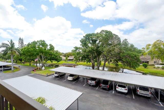 exterior space featuring a carport and a water view