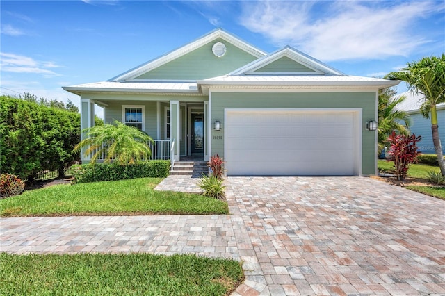 view of front of property featuring a garage and covered porch