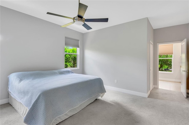 bedroom with light colored carpet and ceiling fan