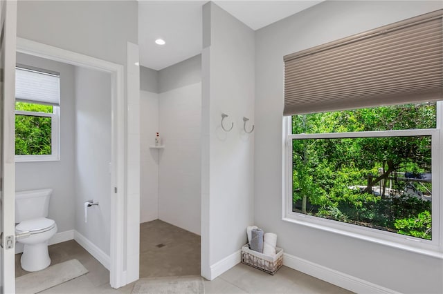 bathroom featuring tile patterned flooring and toilet