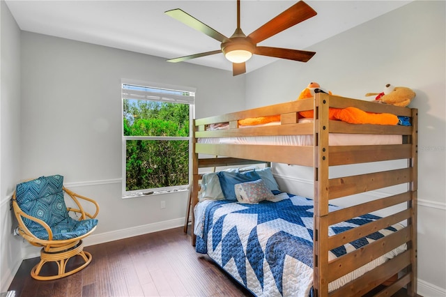 bedroom featuring ceiling fan and dark wood-type flooring